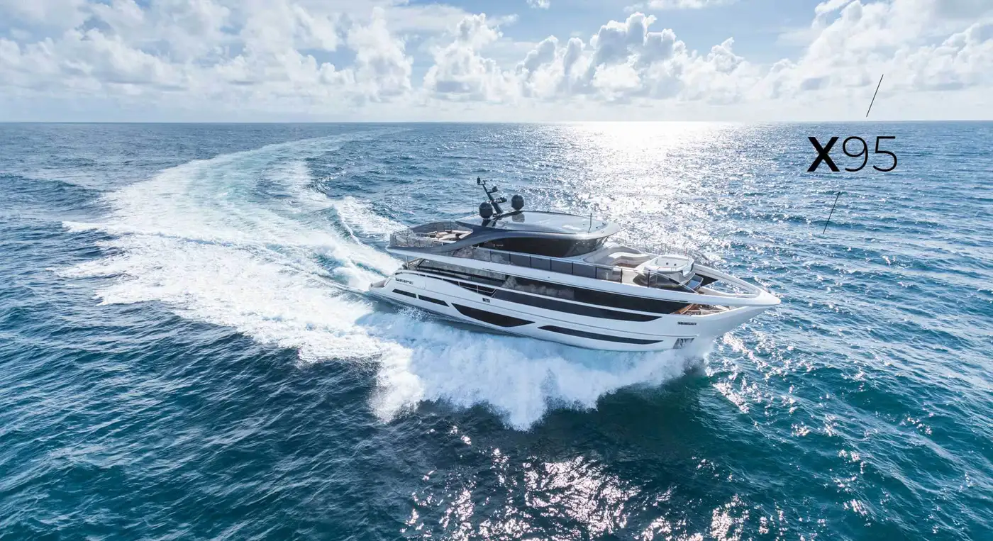 Luxurious yacht Princess X95 navigating through open waters, with waves crashing around its bow.
